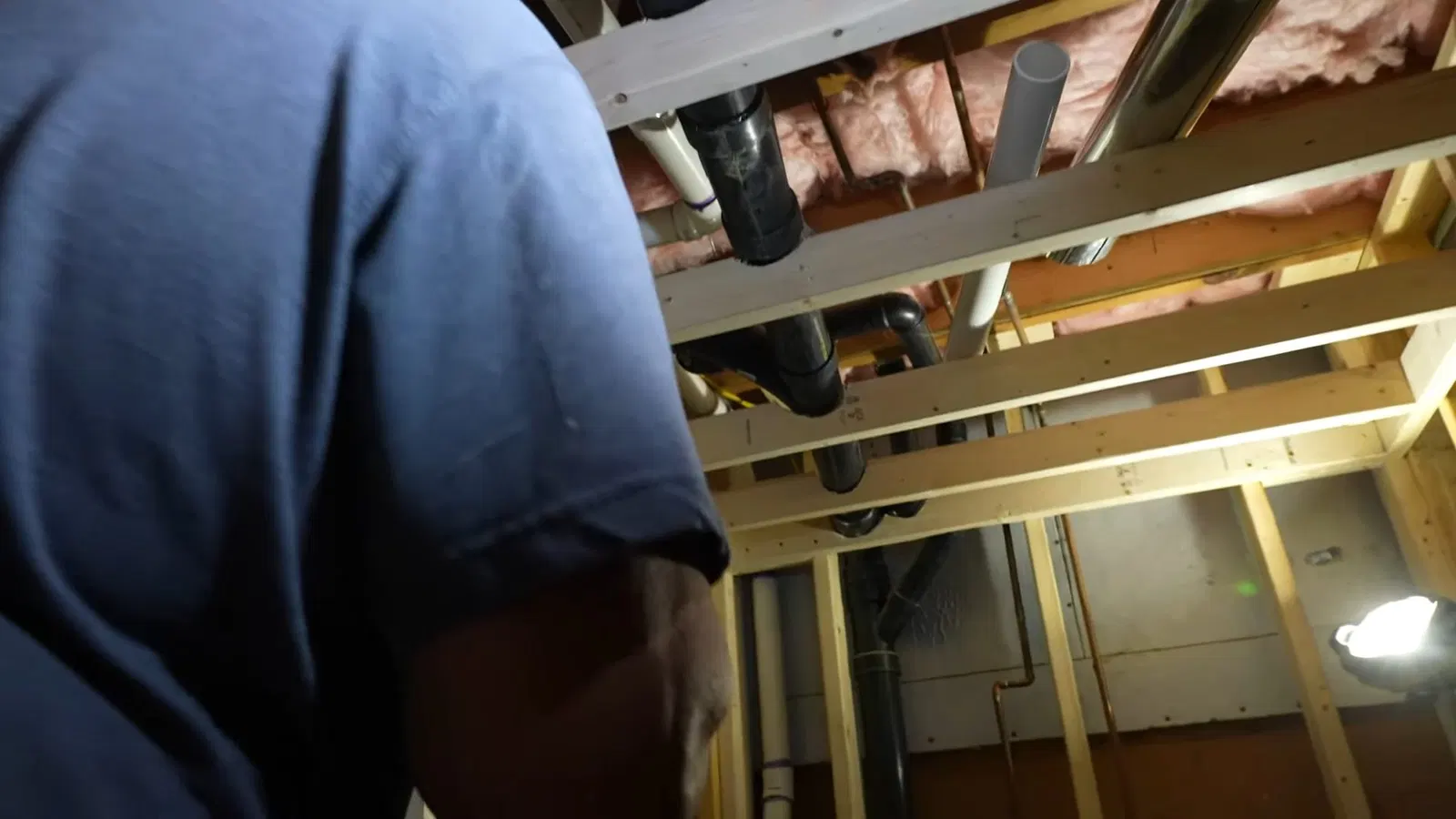 Plumbing service view of pipe slope detail in basement plumbing venting