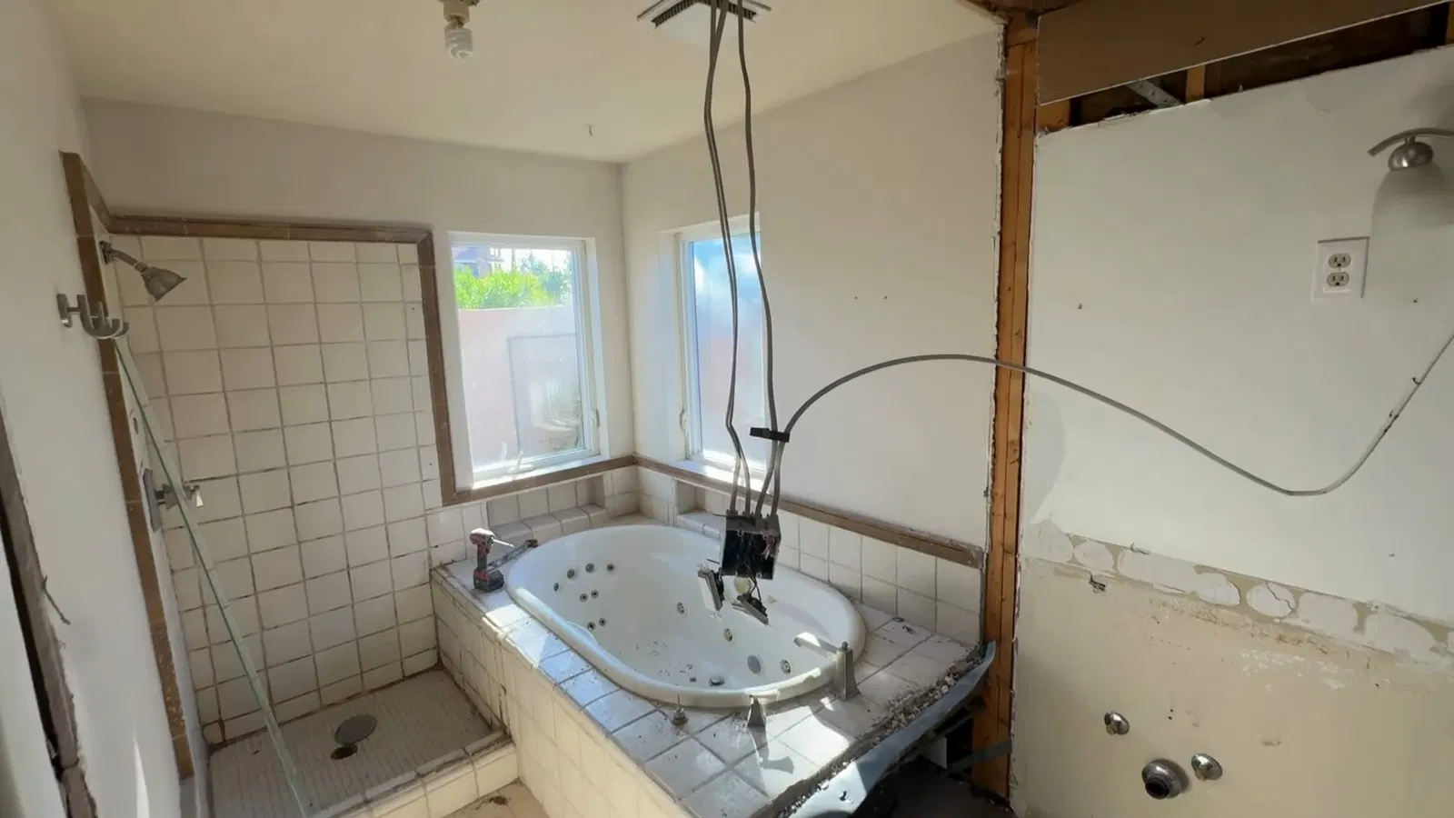 Bathroom plumbing remodel showing shower valve area