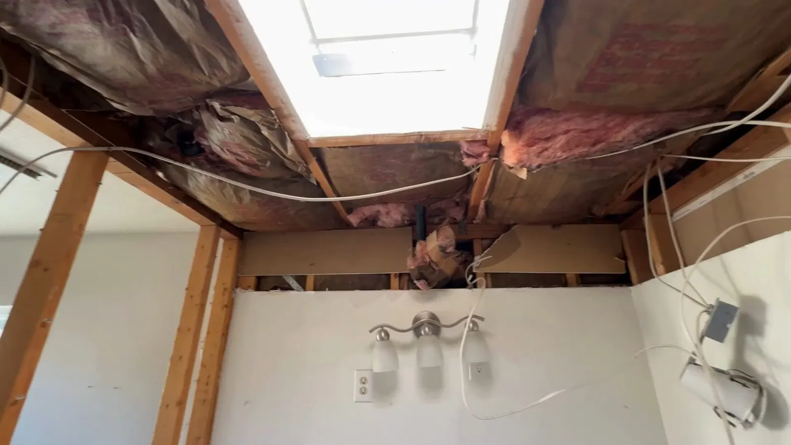 Close view of tub drain area for bathroom plumbing remodel