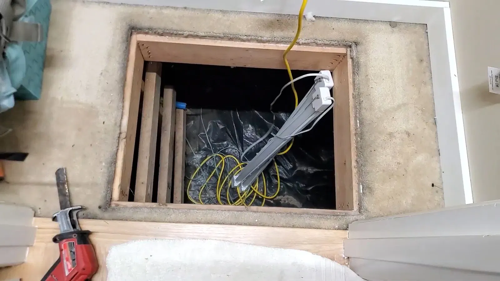 Close view of pipe slope detail for crawl space drain piping