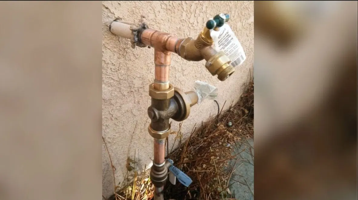 Plumbing service view of supply line connections in outdoor faucet repair