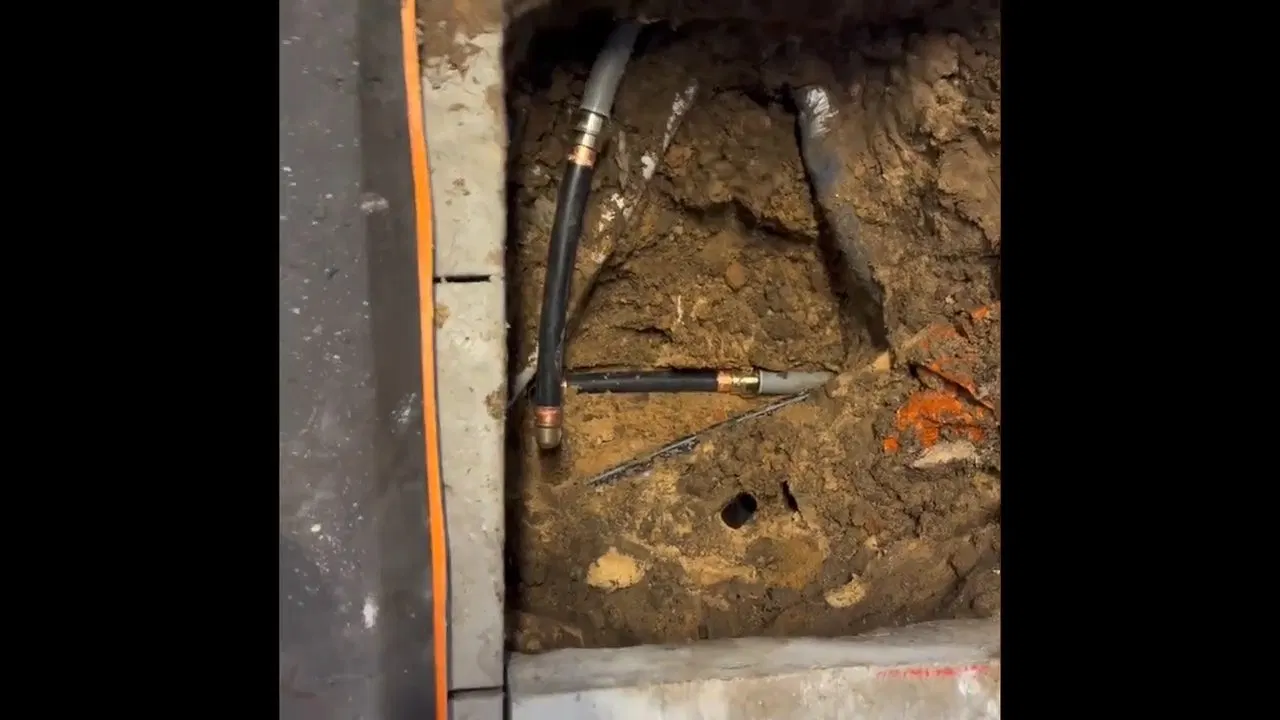 Interior pipe scaling during sewer line repair