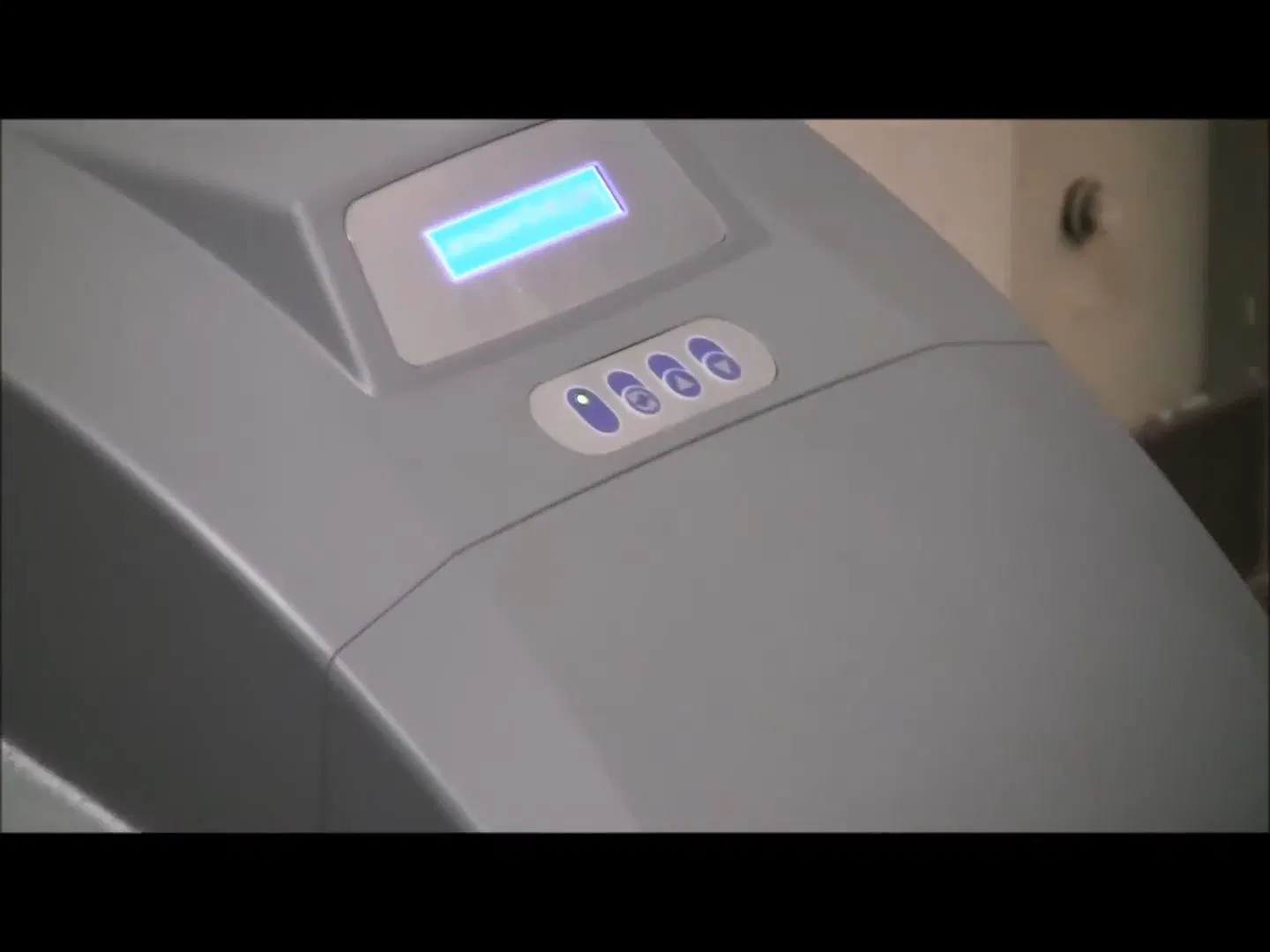 Water softener control programming showing brine tank interior