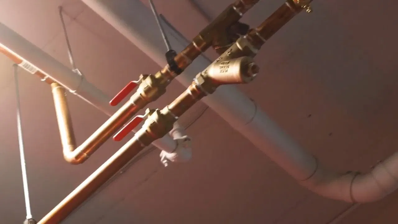 Close view of wall piping for whole home repiping