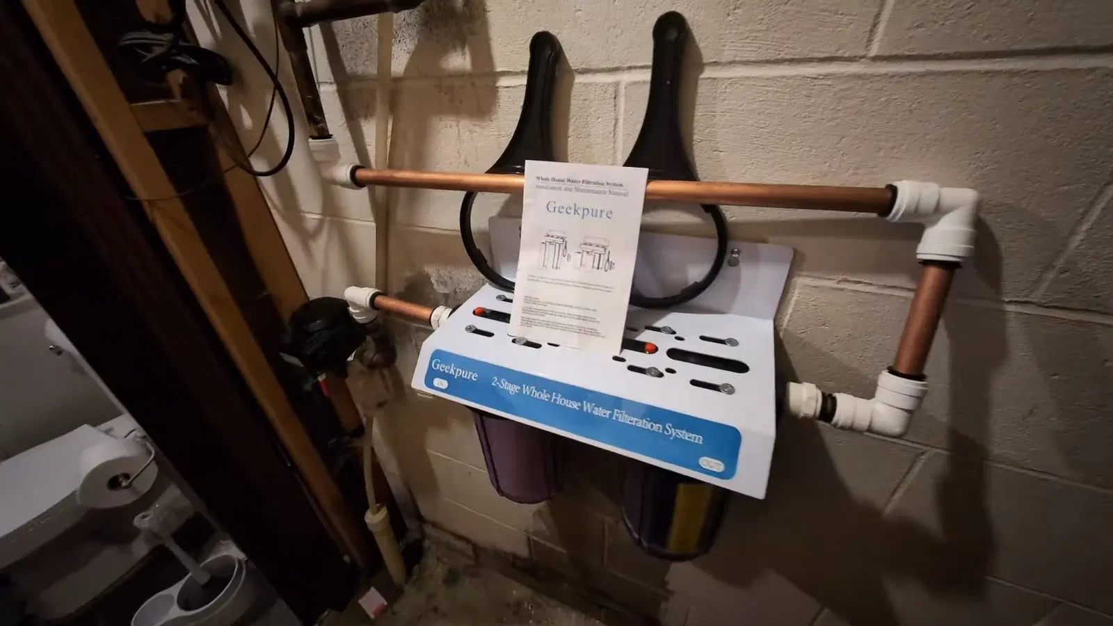 Plumbing service view of filter housings in whole house water filtration